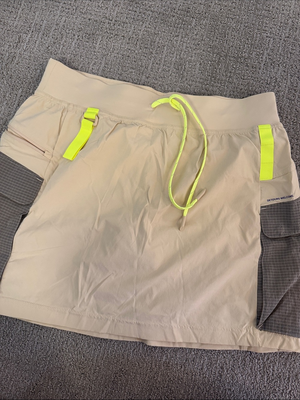 lululemon athletica beige mini skirt/shorts inside with neon yellow accents